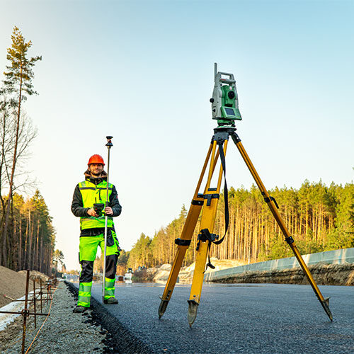 Land Surveyor Measuring Road